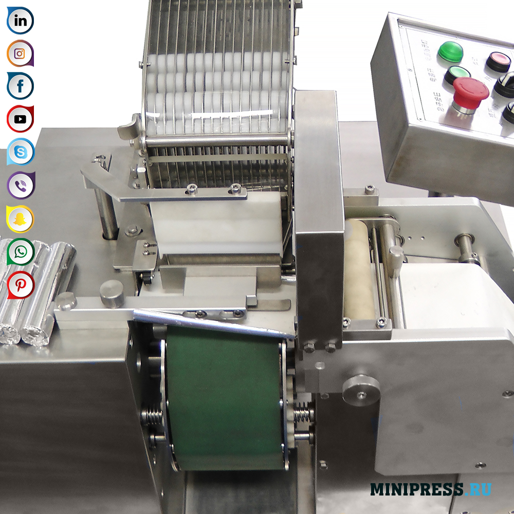 Machine for group packaging of tablets with a diameter of 20-25 mm